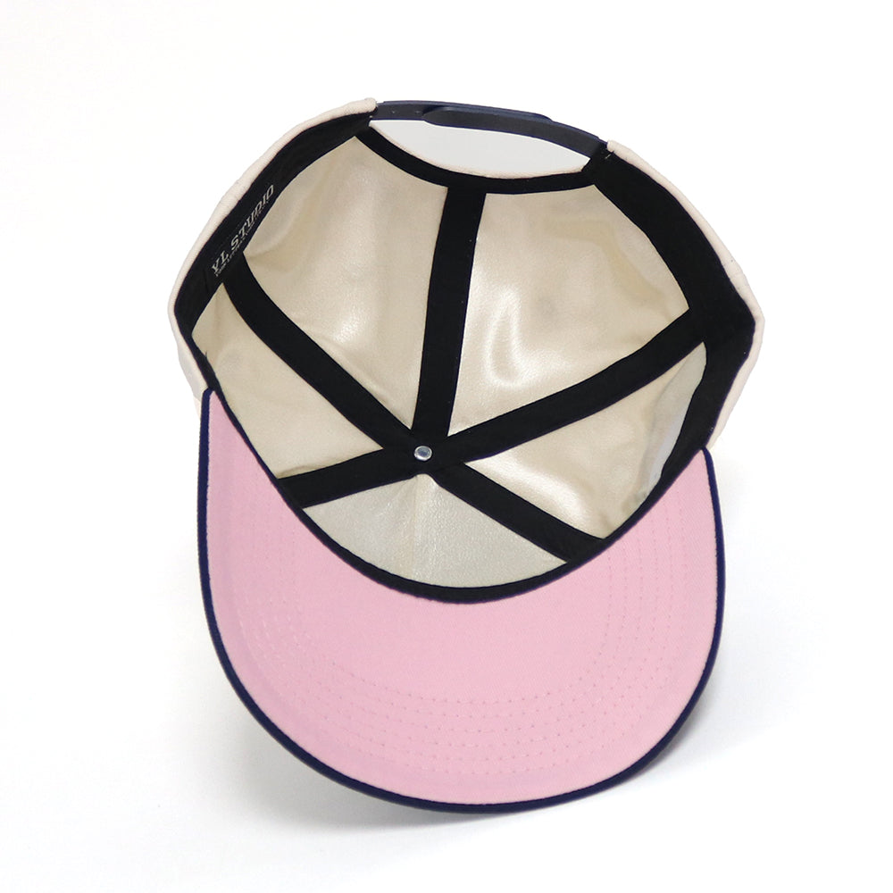 snapback hat showing satin lining and pink brim