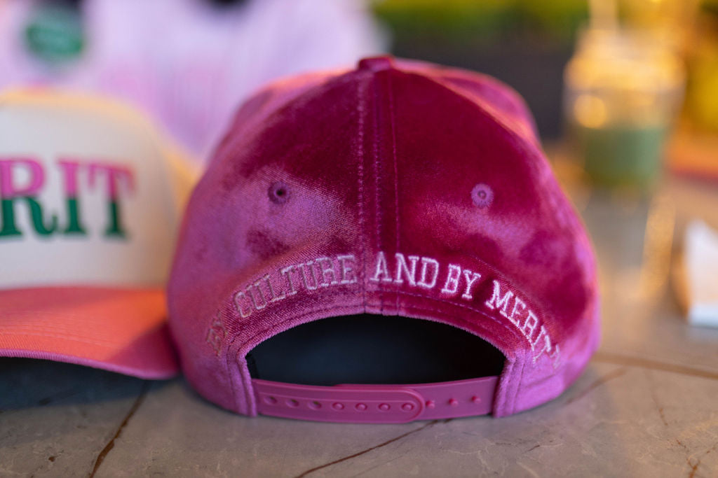 Pink cap with text on a blurred background