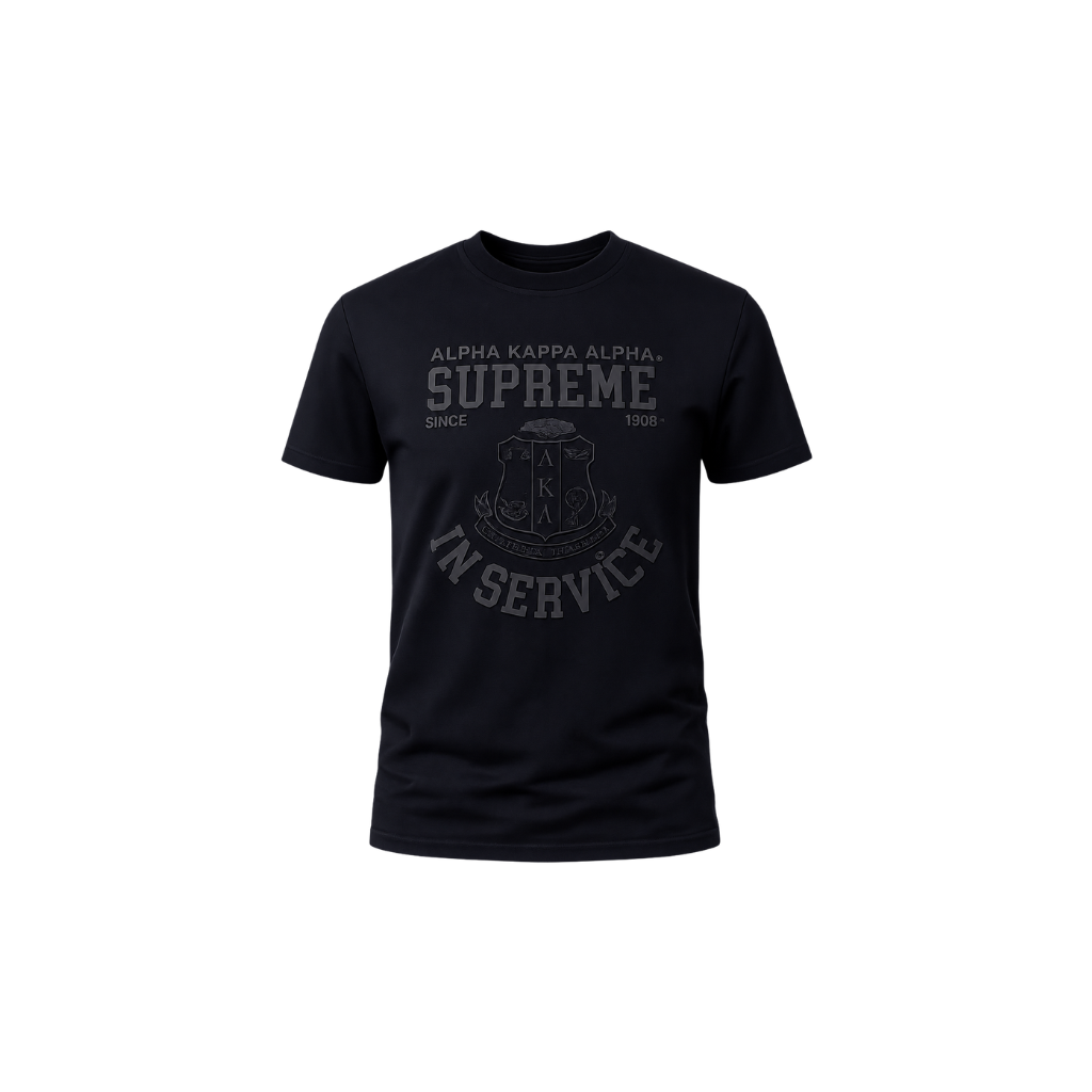 A black short-sleeve crewneck t-shirt with a dark gray graphic print on the front reading 'ALPHA KAPPA ALPHA SUPREME IN SERVICE' with a aka crest in the center, shown against a plain white background.