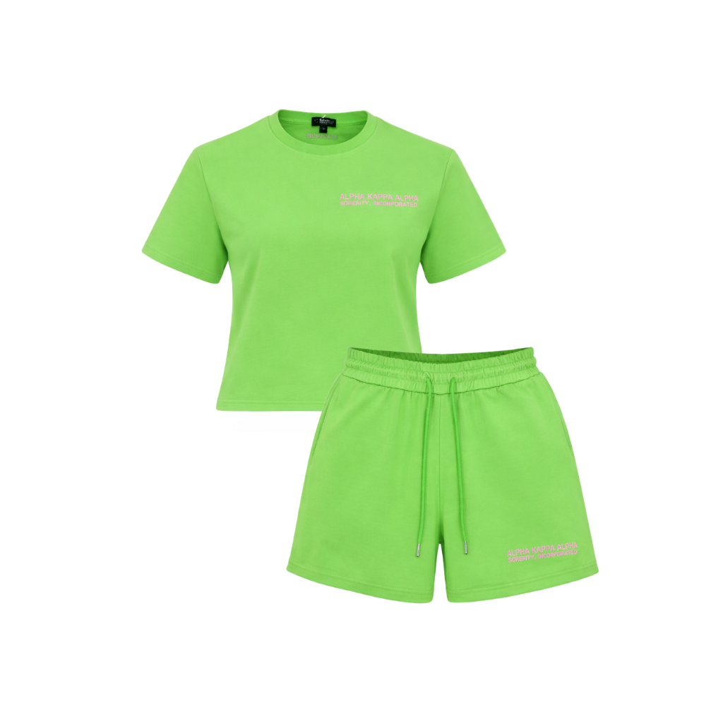 Green t-shirt and shorts set on a white background