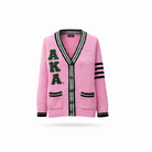 Pink cardigan with dark green 'AKA' letters on a white background